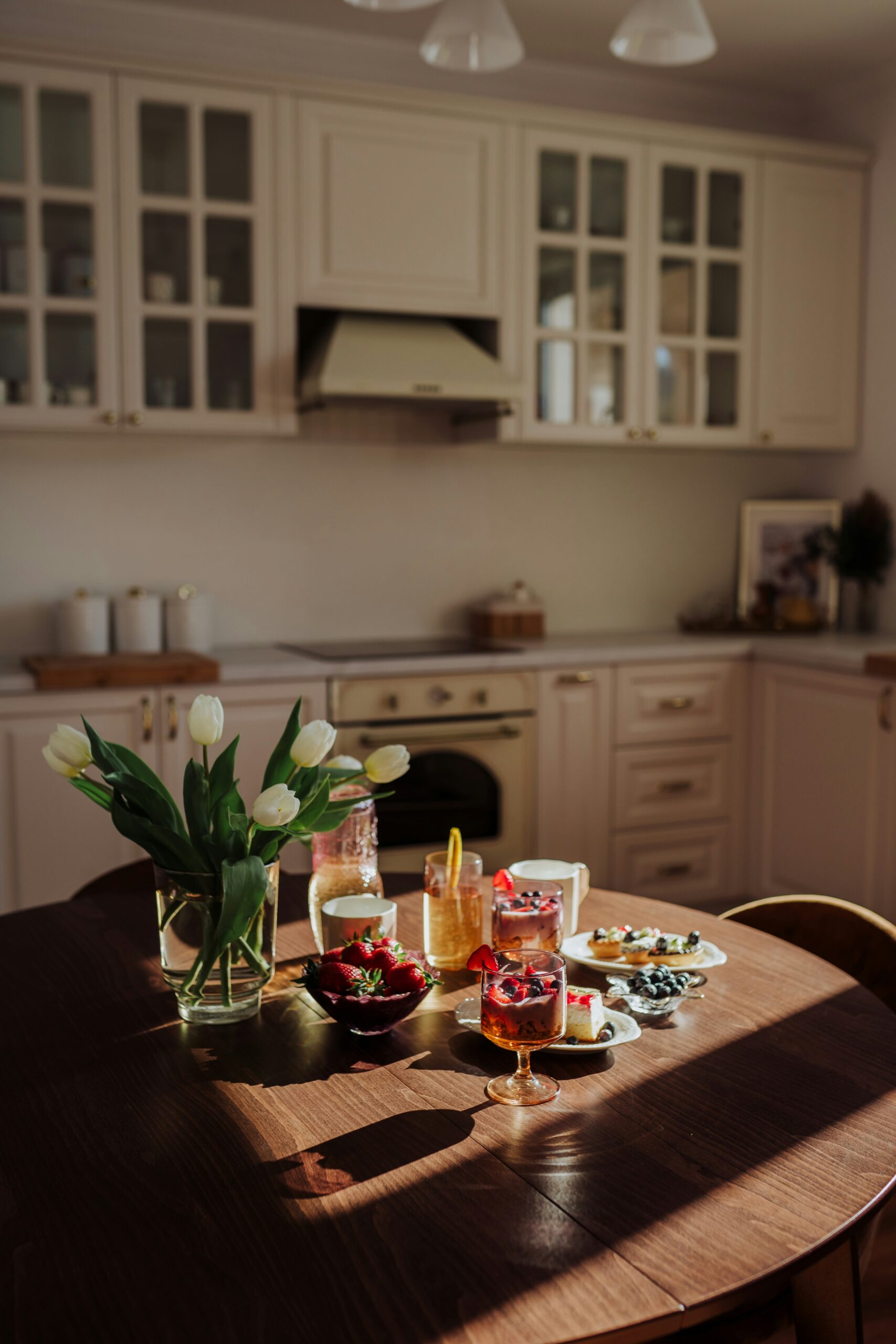 a wooden table topped with glasses of wine
